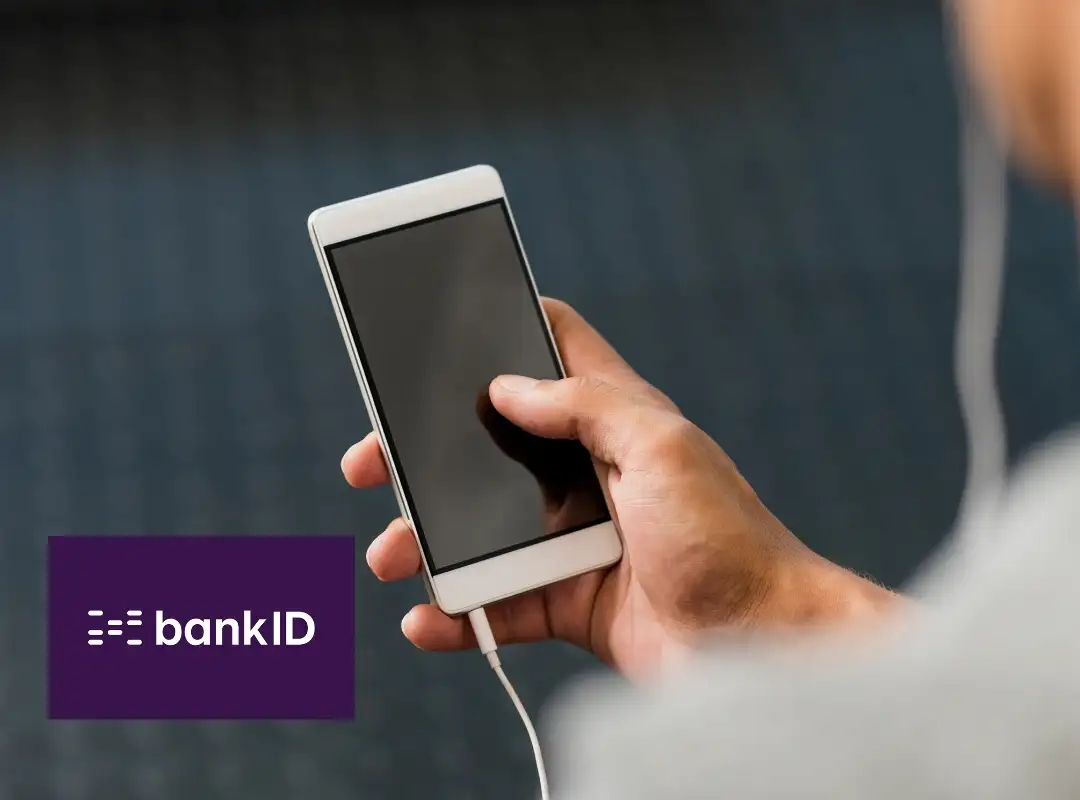 Mobil i hånd, ved siden av BankID logo